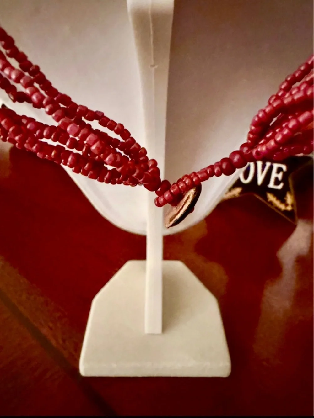 Multi-Strand Red Beaded Necklace with Geometric Pendant